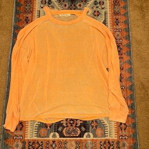 Free people size medium top with peekaboo sleeves